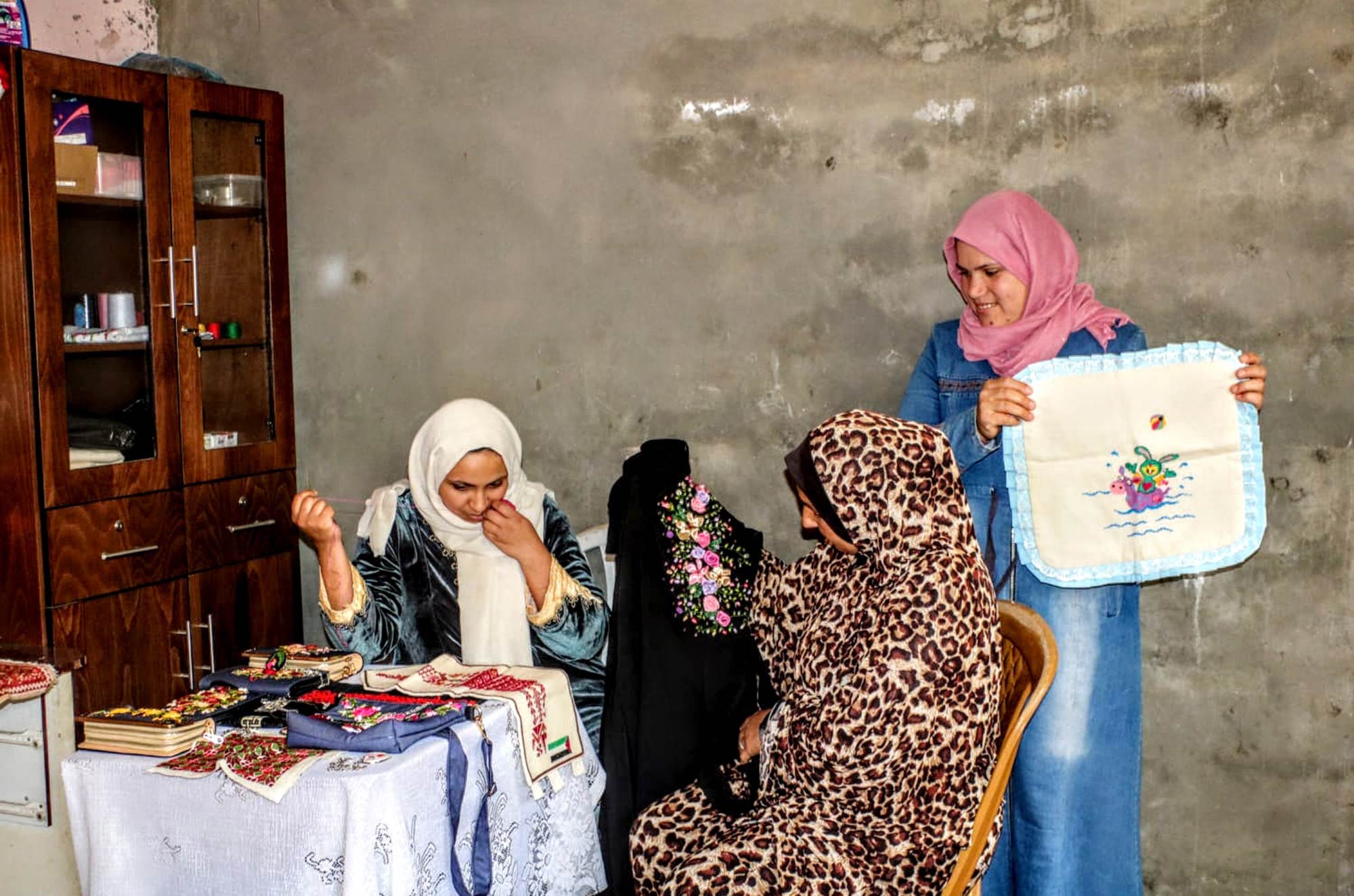 Amal and her neighbors who sometime come by to see her new products.