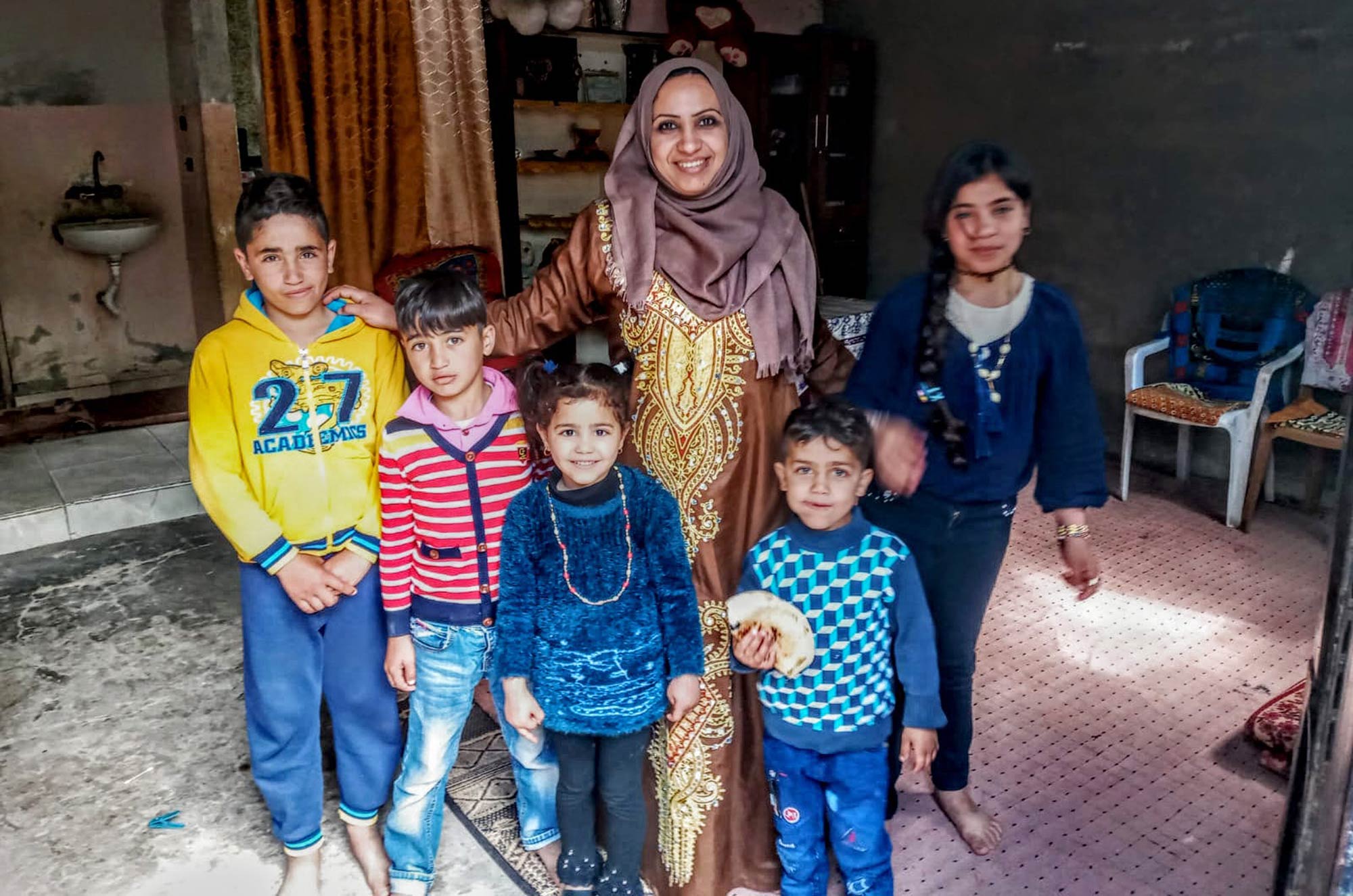 Amal is a mother of four children. One child is her nephew. Amal is a mother of four children. One child is her nephew.