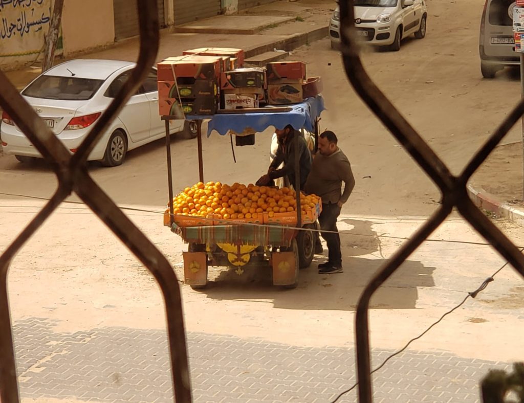 The fruit vendor with his megaphone coming by my window several times a day to sell his oranges, even during the COVID-19 pandemic.
