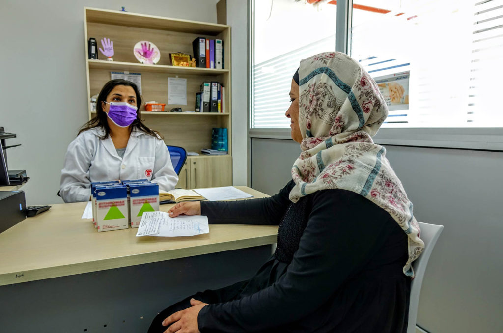 Pharmacist, Abeer Tawil, gives counselling on the effective use of the medicine.