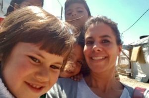 Rudayna Abdo with refugee children at a settlement in Lebanon.