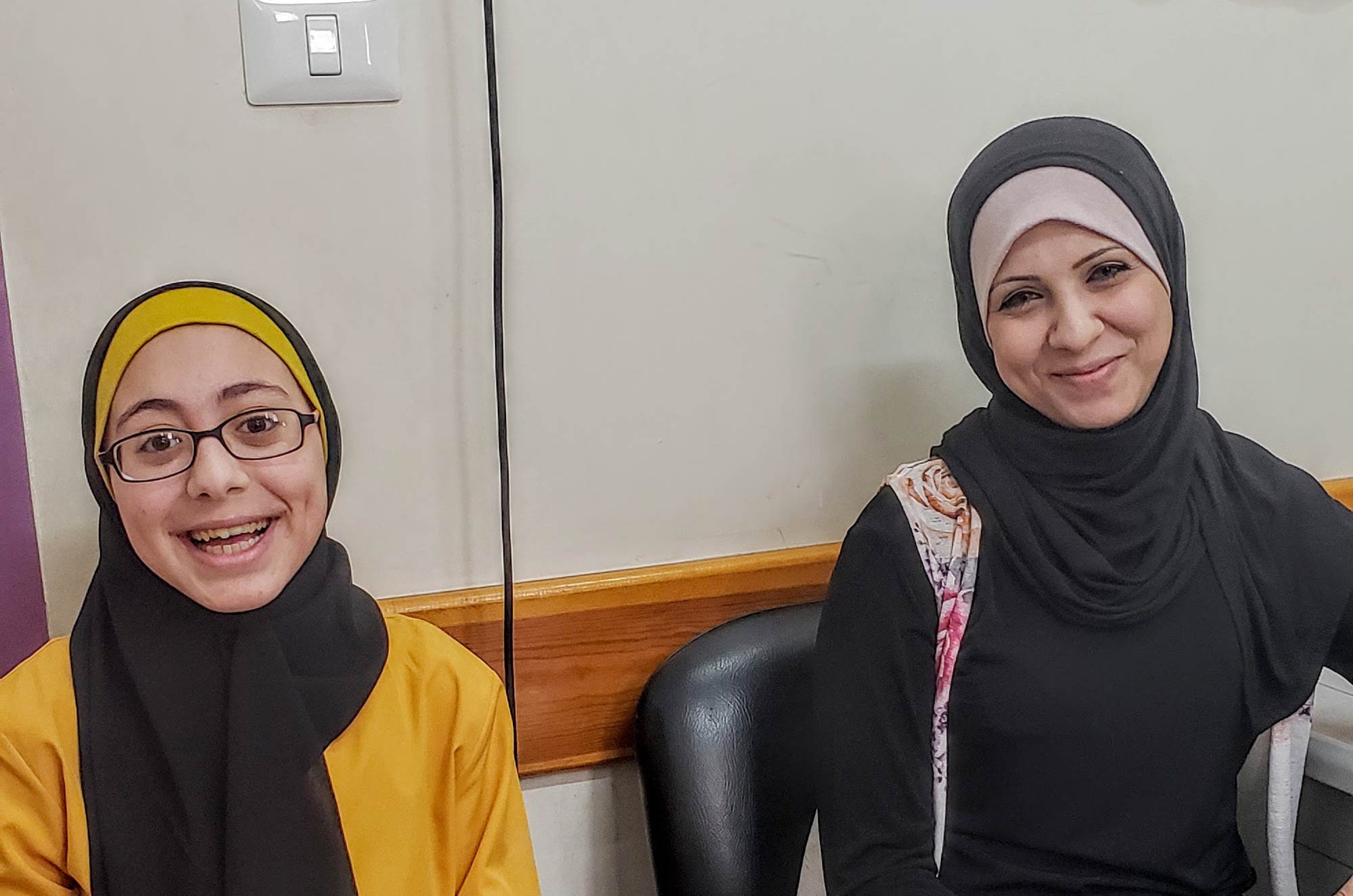 Baraa and her mother, Sahar, at Ard El Insan Clinic.