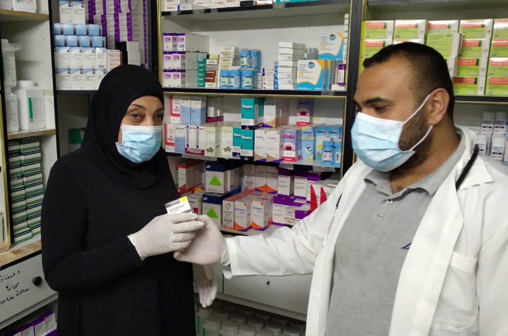 Khawla, a resident of Balata refugee camp, gets her medicine at the Yazour clinic.