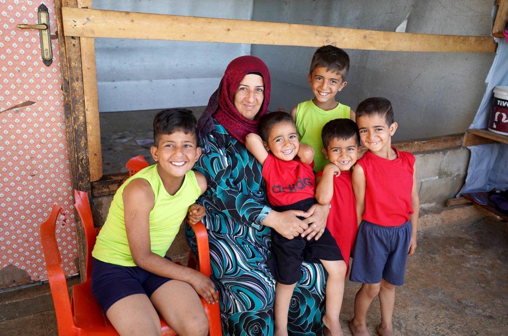 Umm Nasser and her children. Photo by Mohamad Zock.