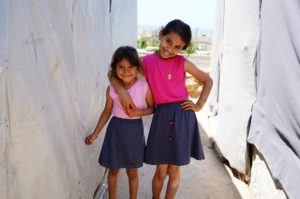 Umm Nasser’s daughters in their new clothes. Photo by Mohamad Zock.