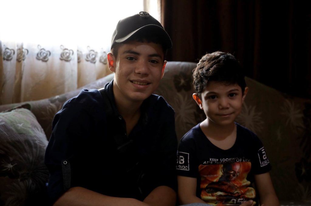 Muhammad (left) with his younger brother.