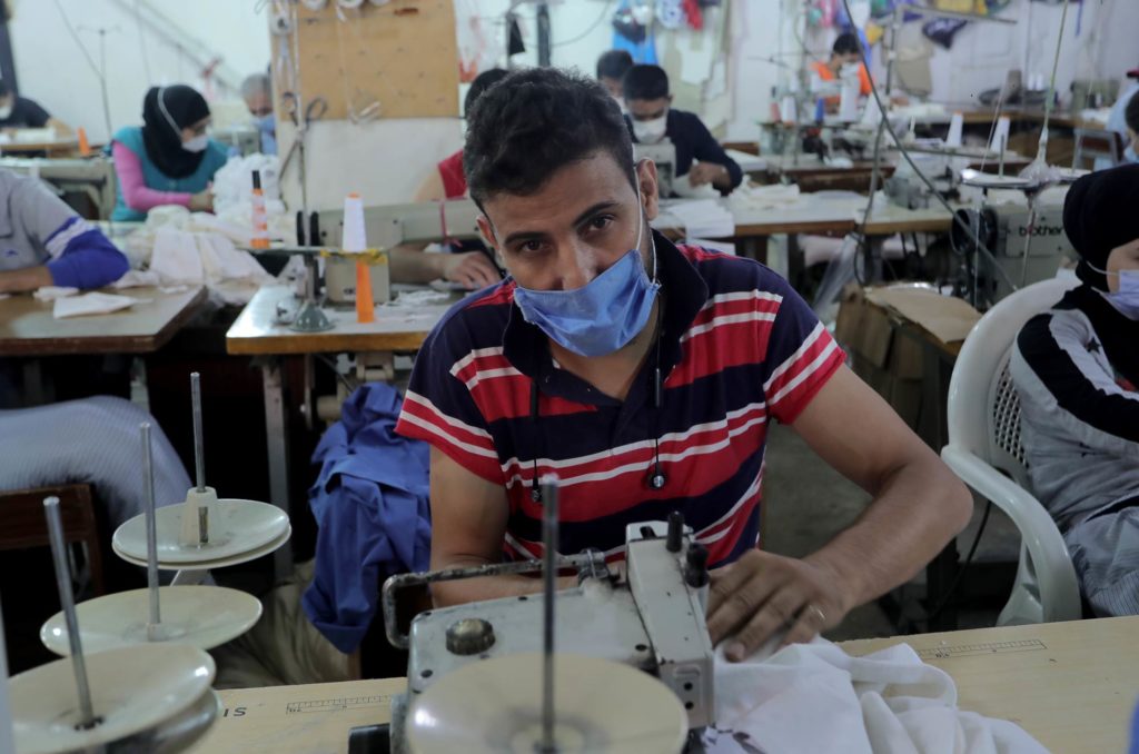 Ahmad at his sewing machine