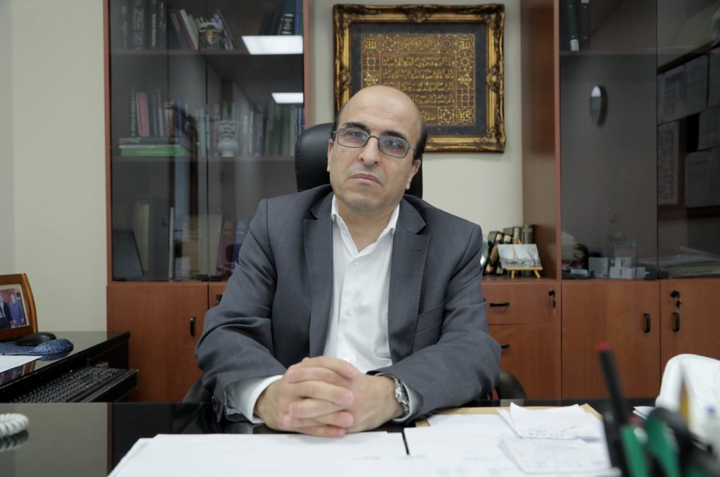 Ahmad Ibrahim at his desk.