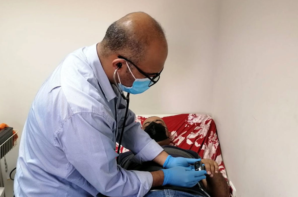 Palestine, West-Bank, Hebron, Dura, asthma Dr. Hassan Alhoroub examines Ahmed.
