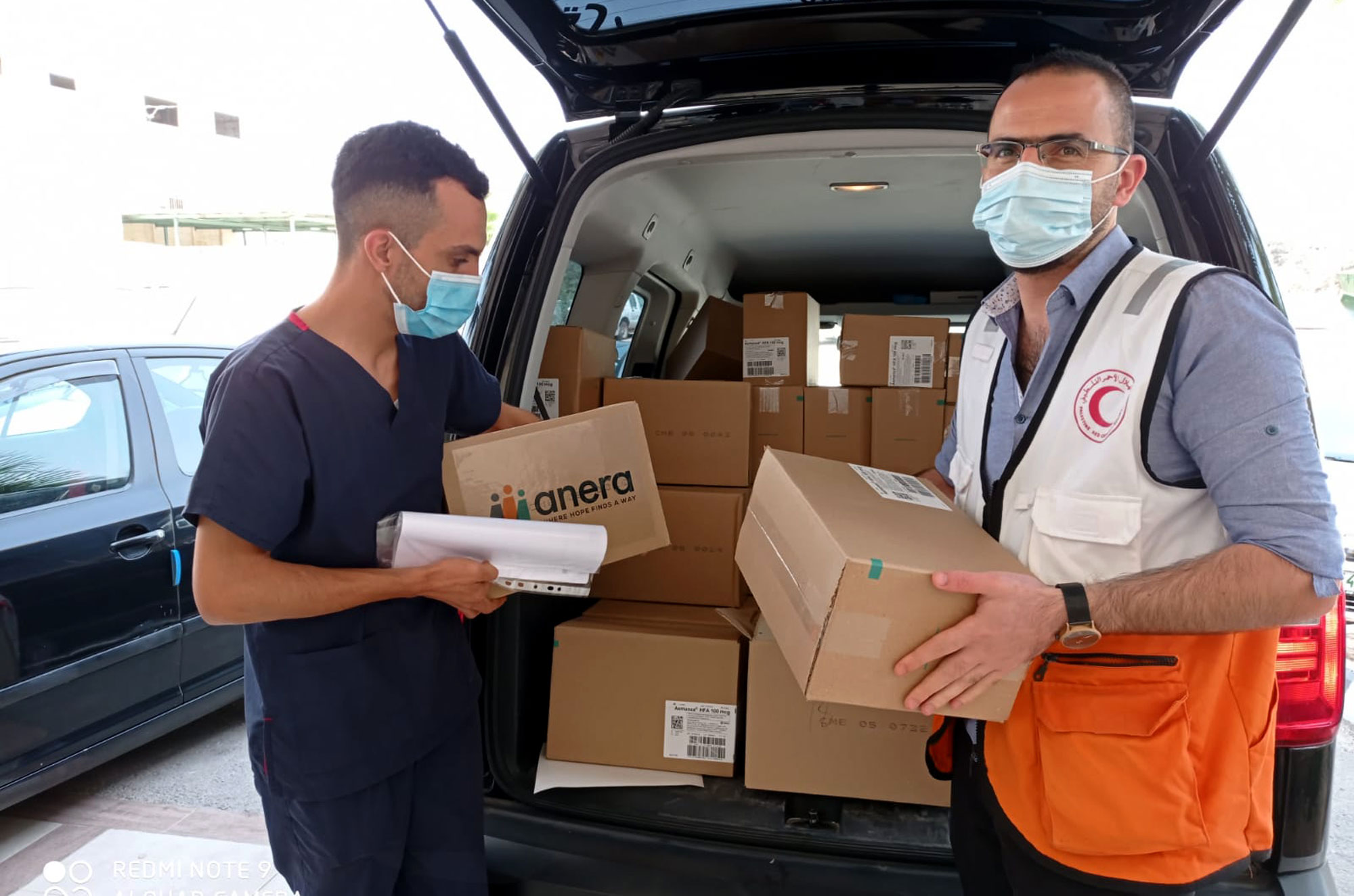Anera unloads a Direct Relief shipment of medicines for the Palestinian Red Crescent clinic in the village of Dura.