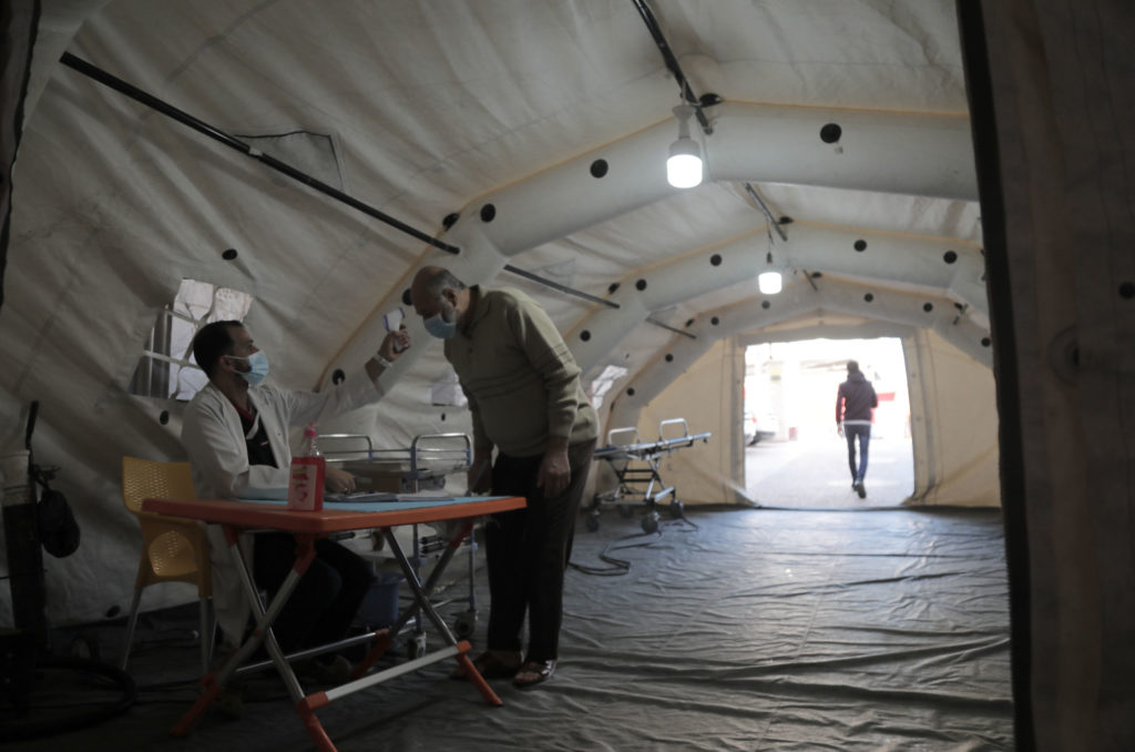 Inside a tent set up at the entrance of Al Quds Hospital to take the temperature of patients.
