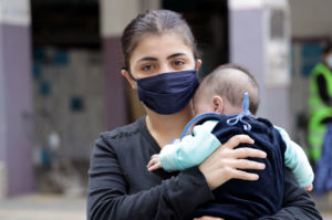 Roba holding infant child.