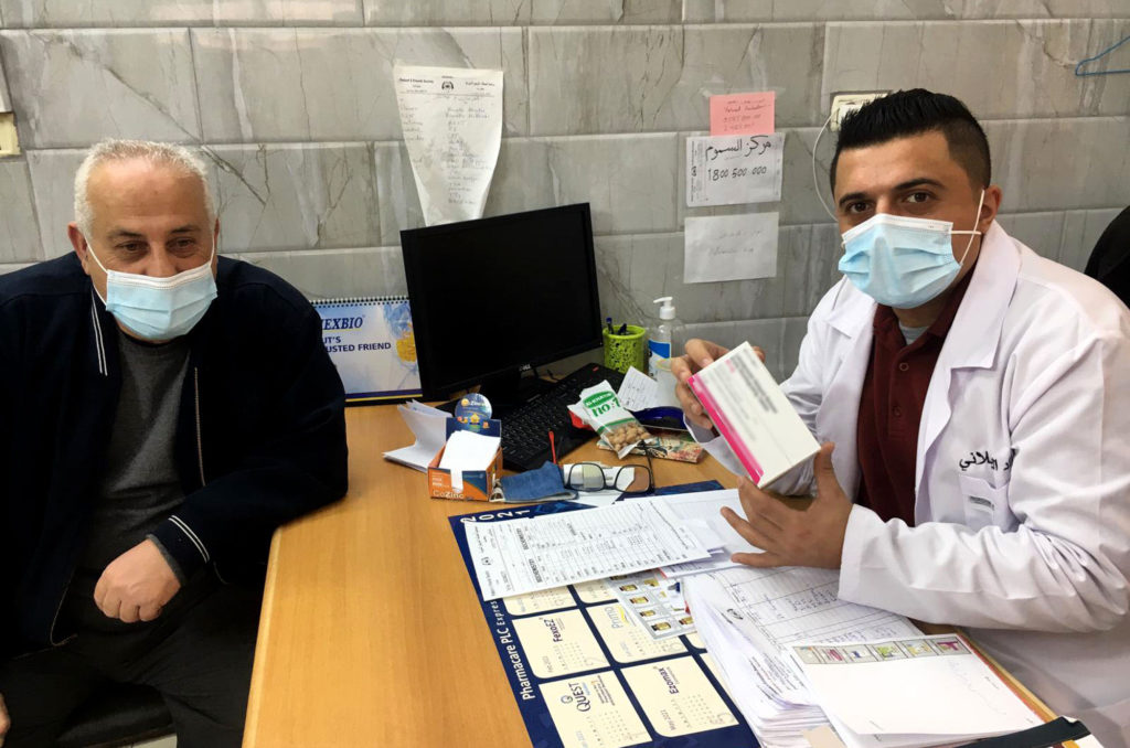 medical-aid, health, Palestine, West-Bank, Ya’bad, Jameel and Foad Foad Kilanin, a physician at the Patients' Friends Society Clinic, meets with Jameel for his follow-up appointment.