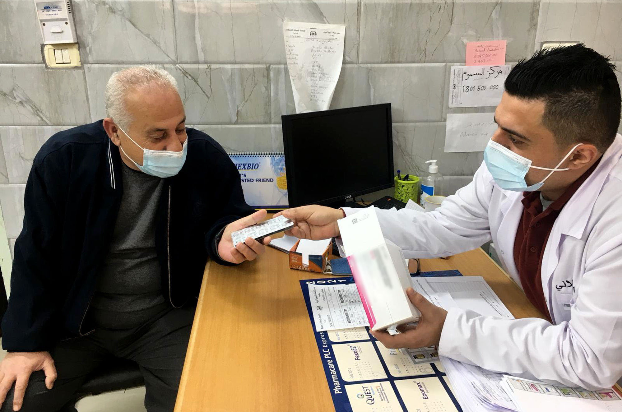 Foad Kilanin, a physician at the Patients' Friends Society Clinic, meets with Jameel for his follow-up appointment.
