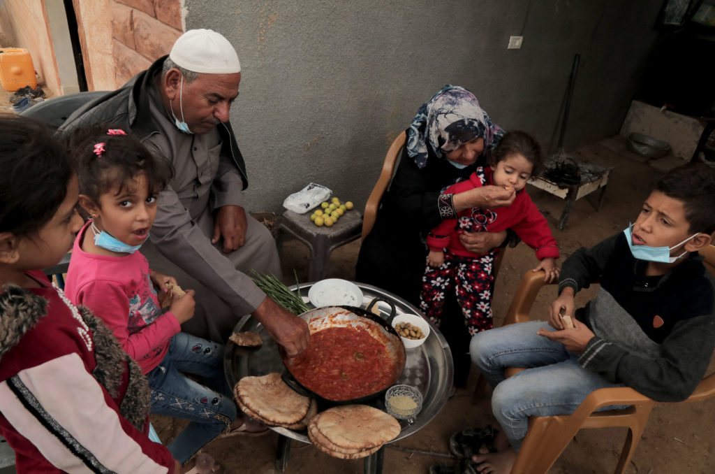 Halima's family gather for a meal.