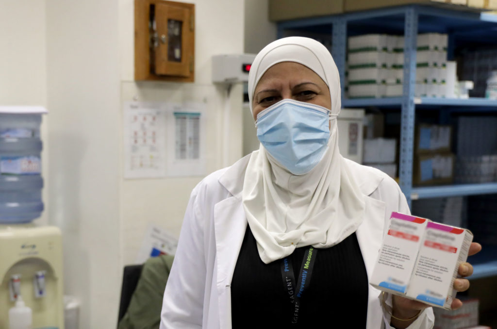 health, lebanon, cancer, chemotherapy, cold-chain, olfat with cisplatin Olfat Muhammad Al-Osta holding boxes of cisplatin