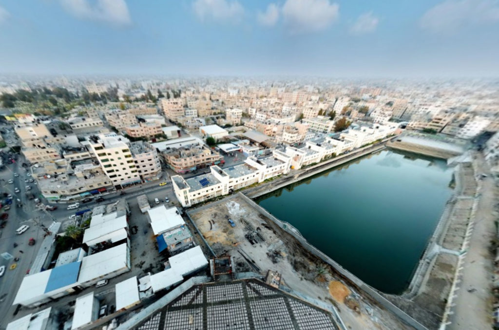 The Asqula basin, a large pool of water in an urban area, visible from above.