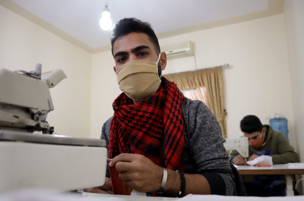 Alaa at his sewing machine