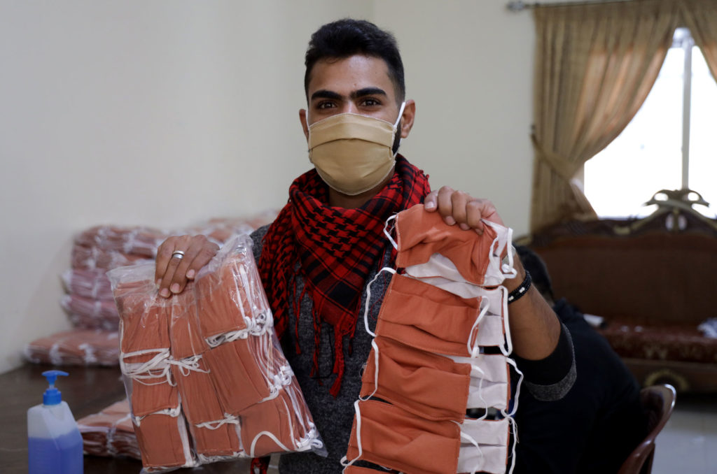 sewing, lebanon, education, vocational, sewing, youth, employability, job-skills-training, alaa with finished masks Alaa holds up the finished masks, packaged for distribution.