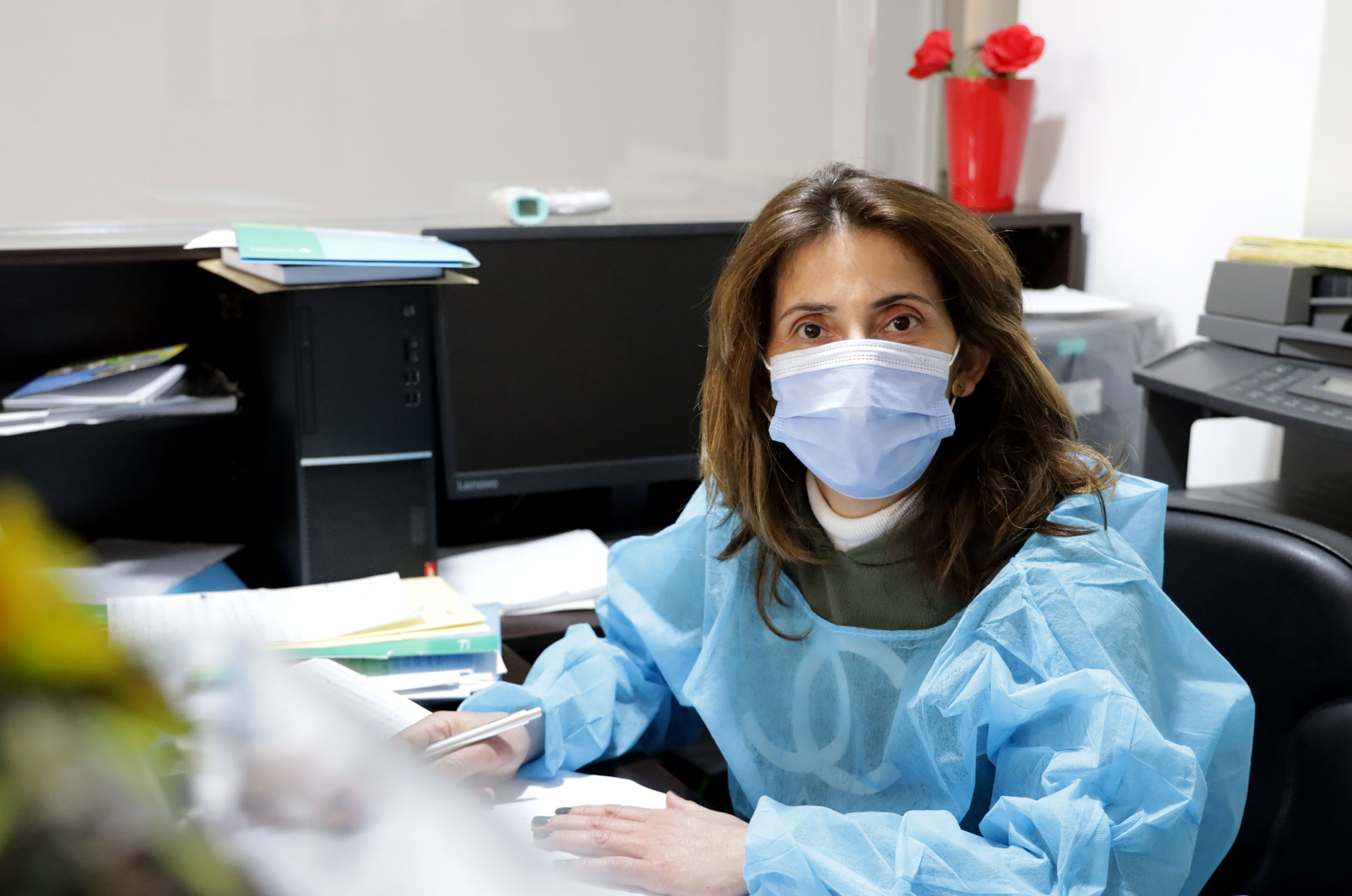 lebanon, medical-aid, health, medicine, mar-sassine-medical-center Enaam at her work desk.