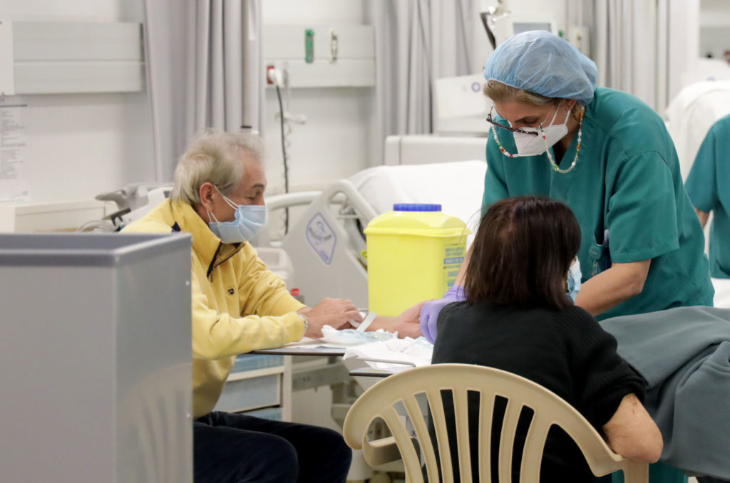 Patients in the unit receive care.