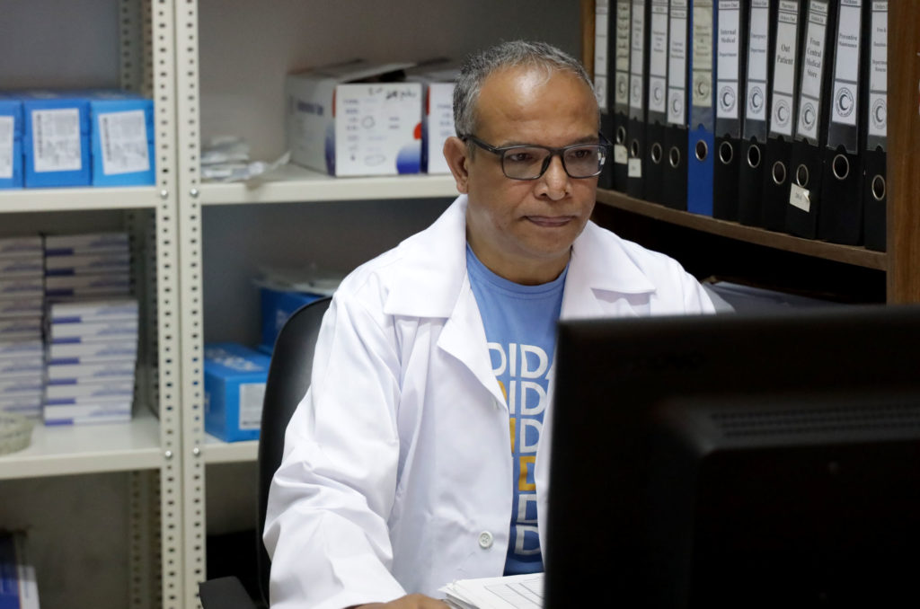 Dr. Ibrahim El-Ahmad at work at his desk