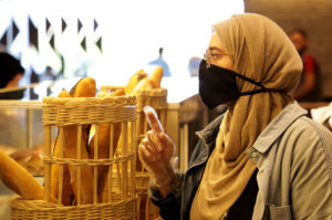 Amira helping a customer at Diwan.