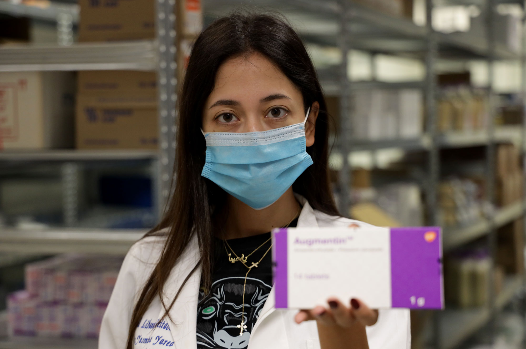 Dr. Yasmina Yared holds up a package of medicine.