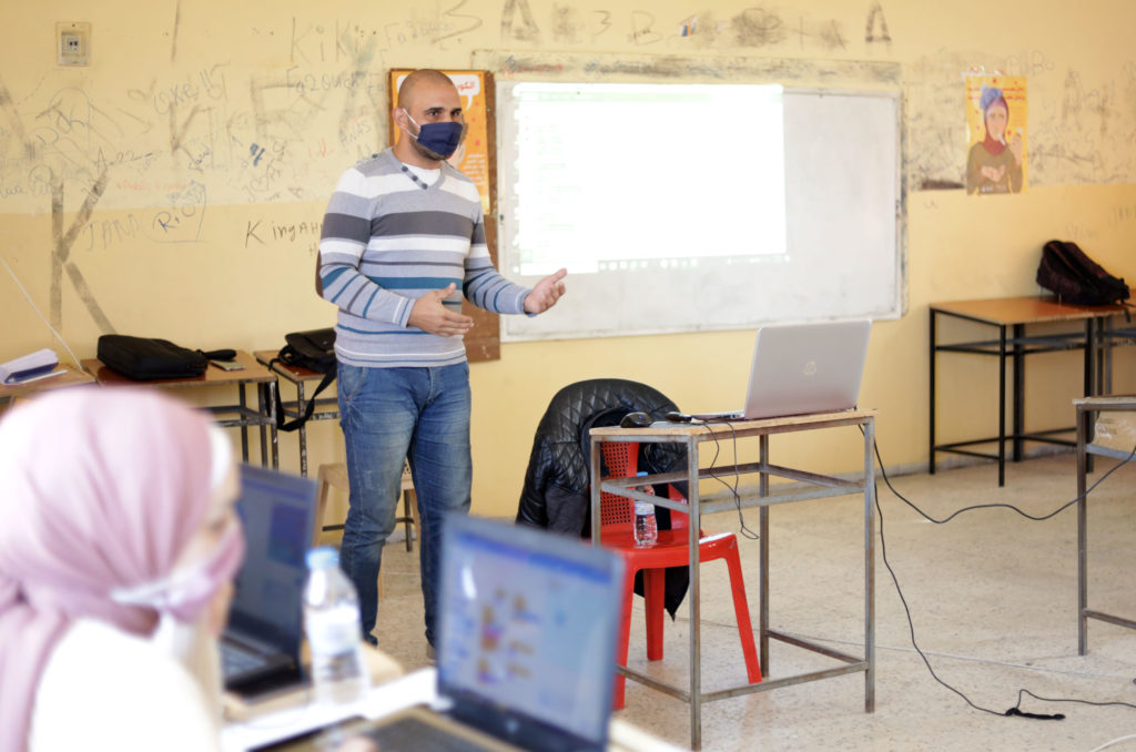 lebanon, education, youth, employment, vocational, coding Ahmad-Mustapha-_-Teacher-EDIT Ahmed at the head of the classroom.