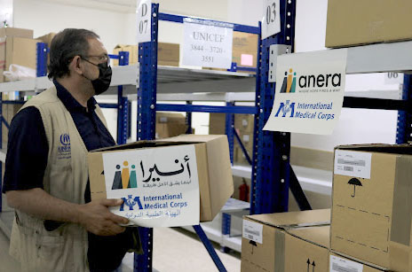 An IMC team member collects their allocated medications from the JHCO’s warehouse. This marks the first successful joint shipment between Anera and IMC with medications donated from IHP.