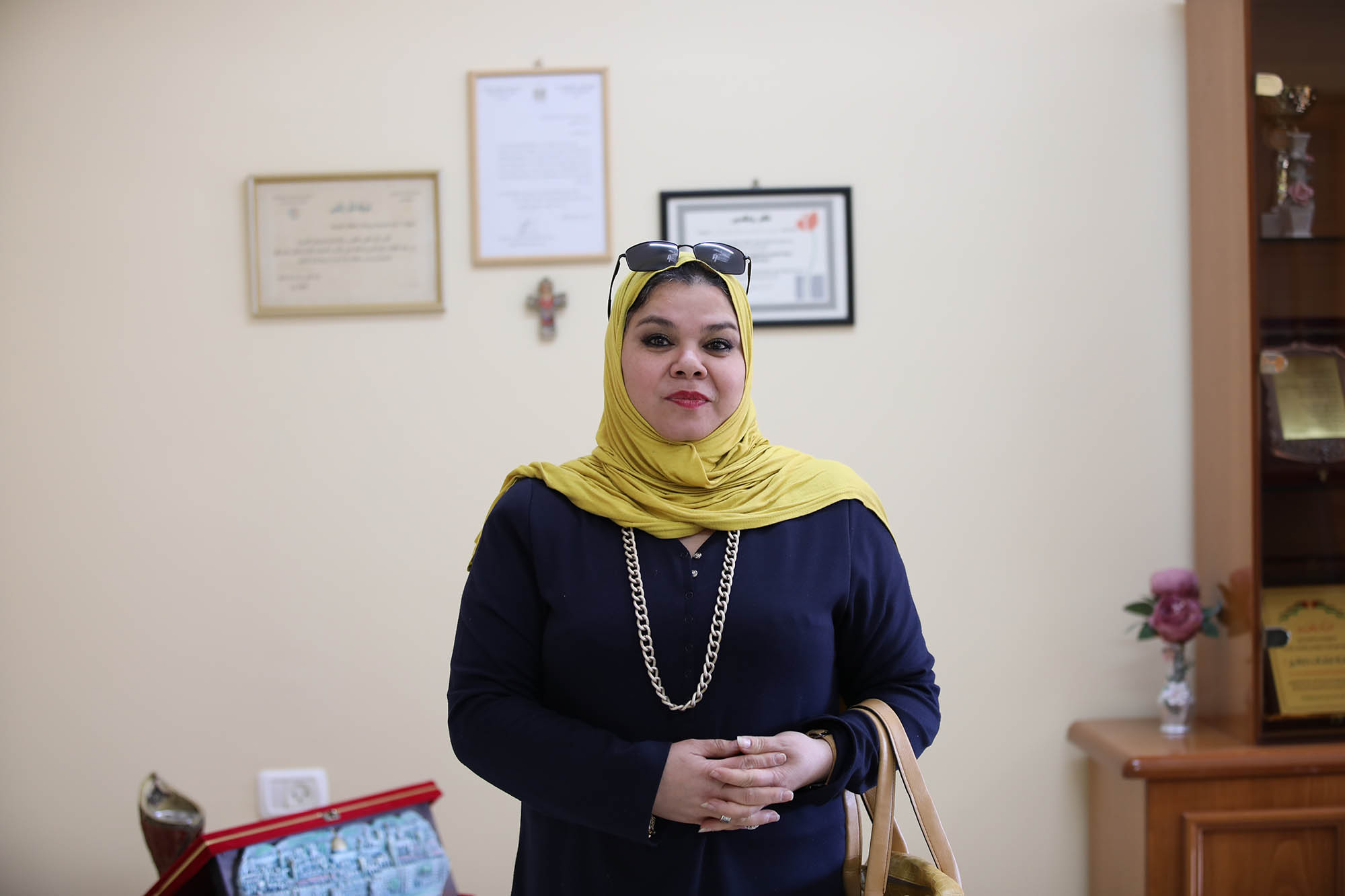 Ms. Waheba Abu Motlek in office at the Rosary Sisters School in Gaza City.