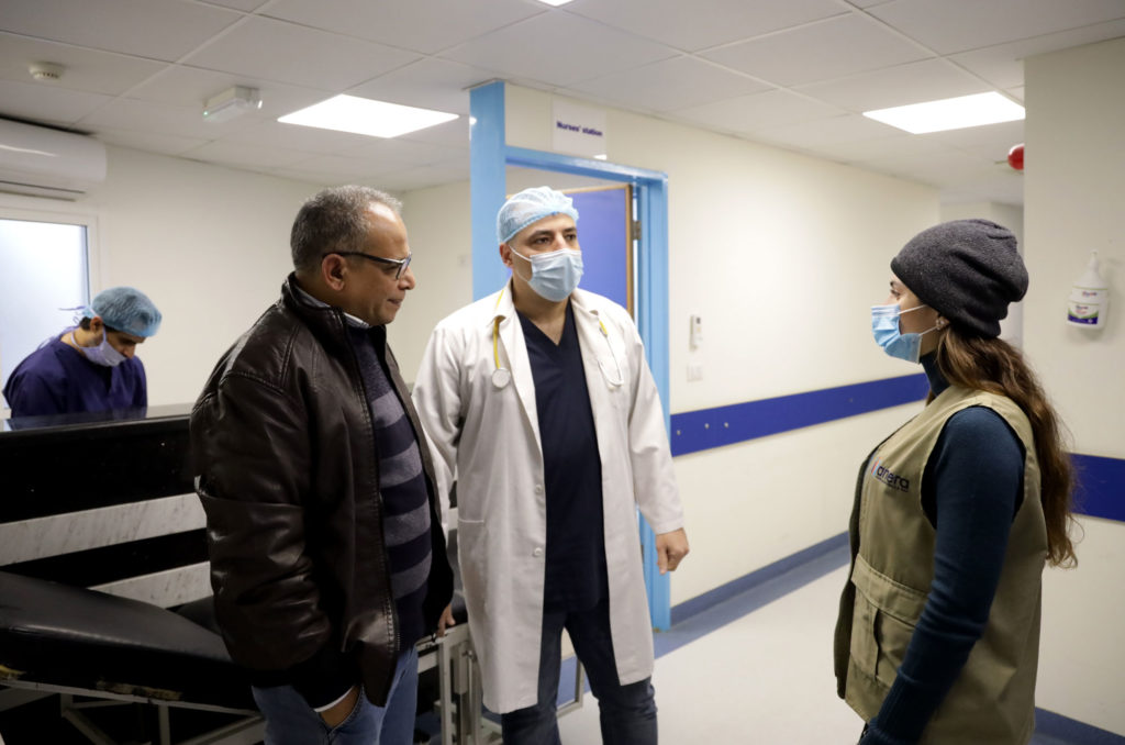 Anera speaks with staff at Haifa Hospital.