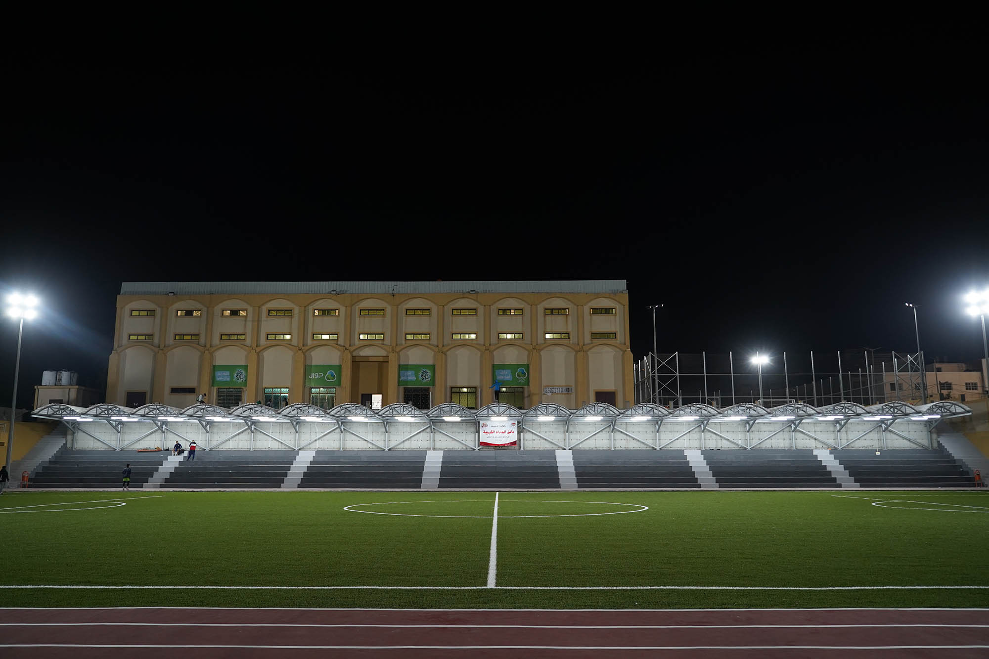 Gaza sports club football field at night.