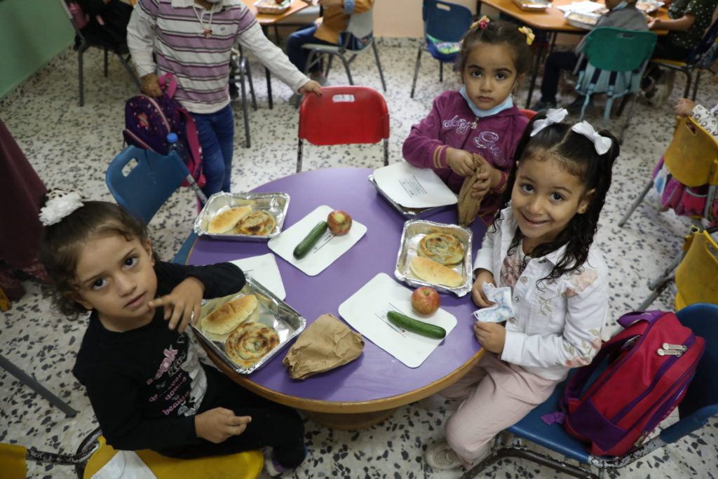 Children eat breakfast at school