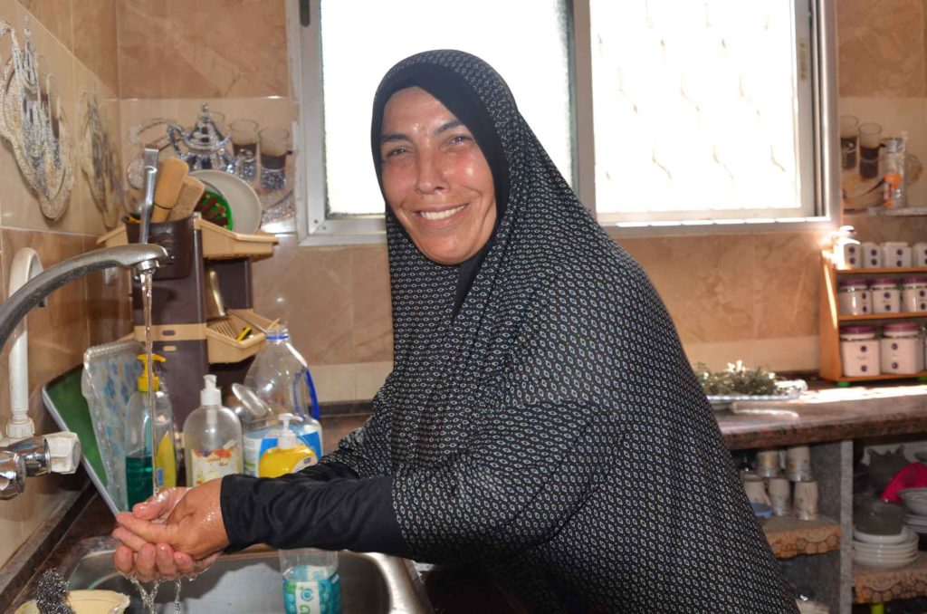 Hanan is happy to have water from the tap in her own home.