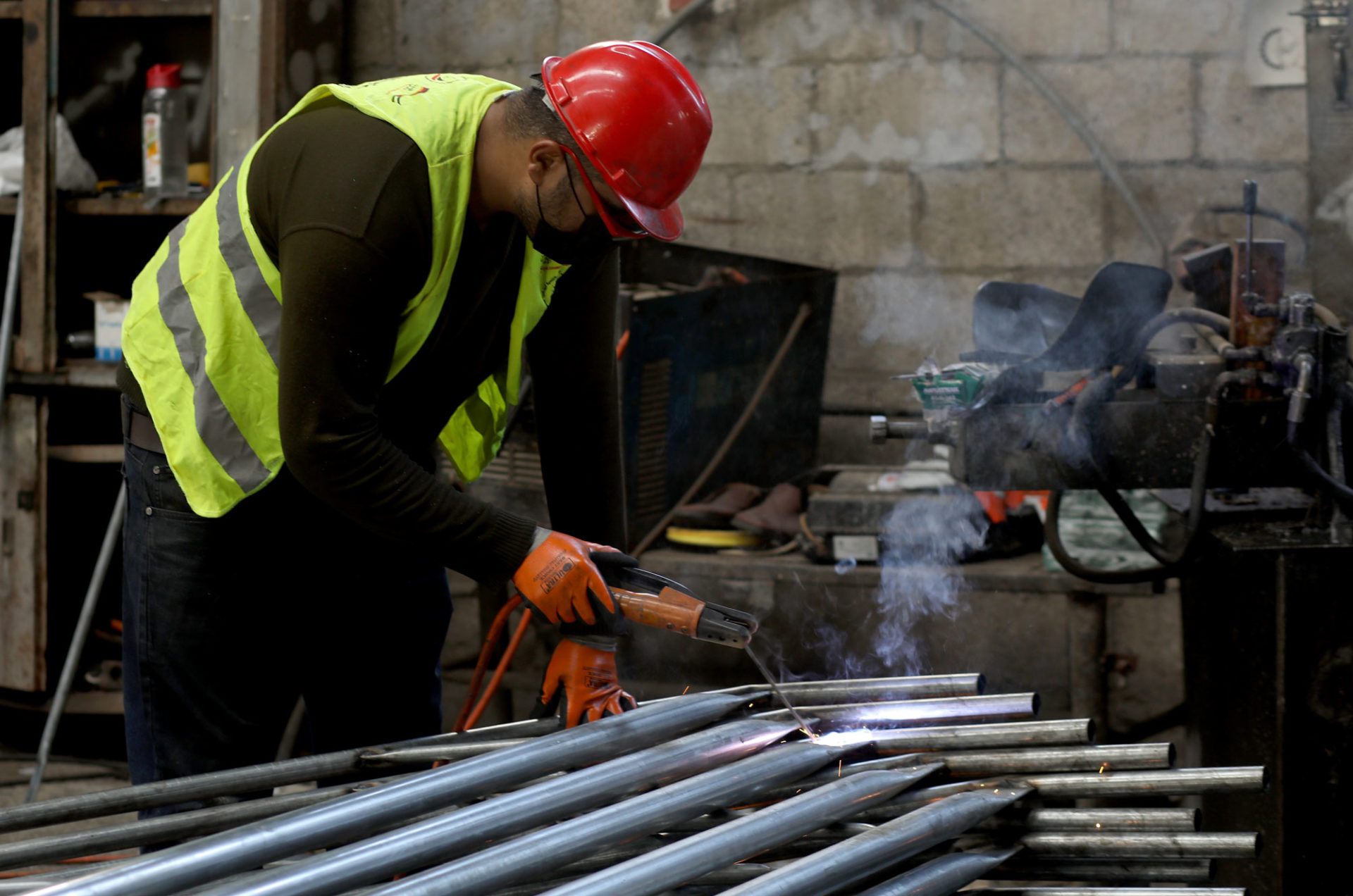 Factory worker welding.