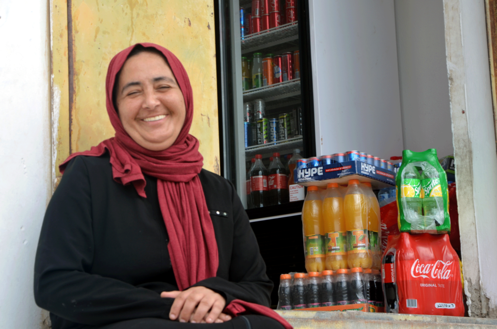 women-can, west-bank, palestine, kawthar, DSC_0109-EDIT Kawthar smiles in front of her shop