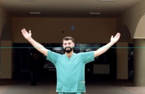 Ali nurse in front of Tripoli hospital where he works
