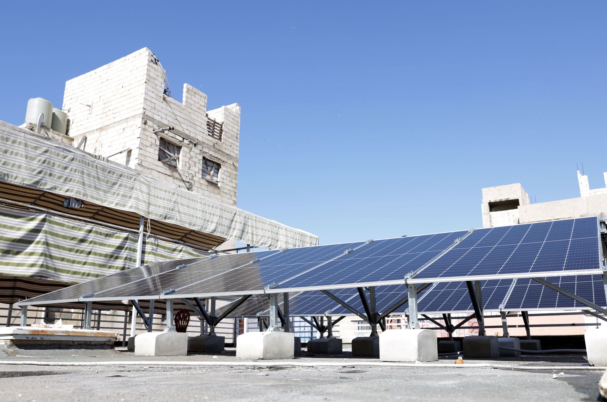 Solar panels installed on the roof of a community center.