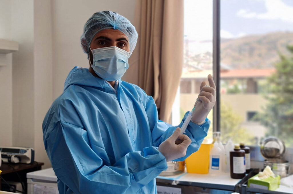 A nurse wearing personal protective equipment that Anera provided to the Baalbek Governmental Hospital