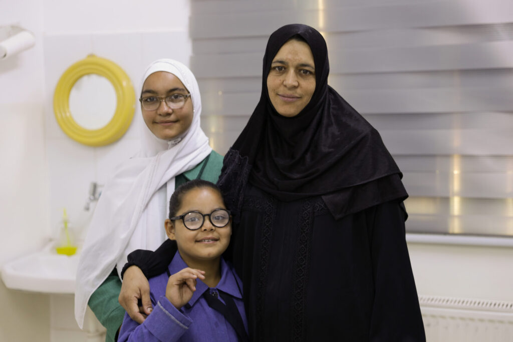 Nasreen with two of her daughters at the clinic.