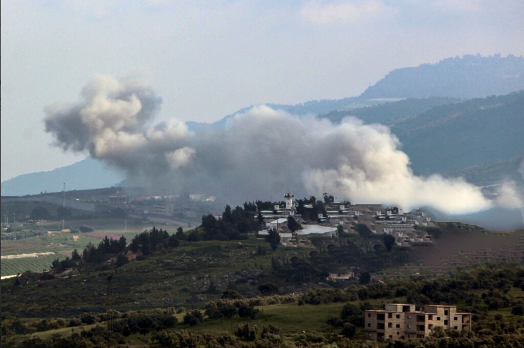 White smoke billows above the landscape of Lebanon.