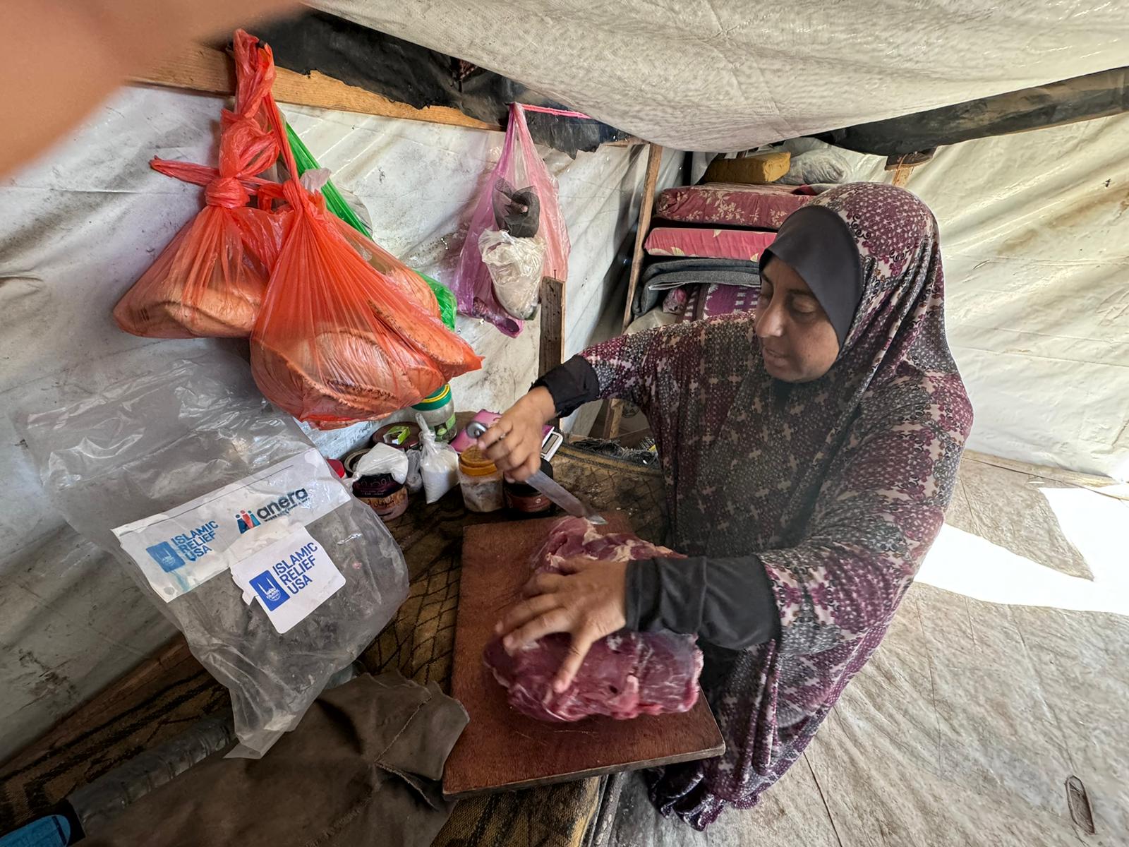 WhatsApp Image 2024-09-18 at 3.59.21 PM Nabila preparing the Qurbani meat to make mlokheyeh, a traditional dish made from leafy greens, usually served with rice and meat.