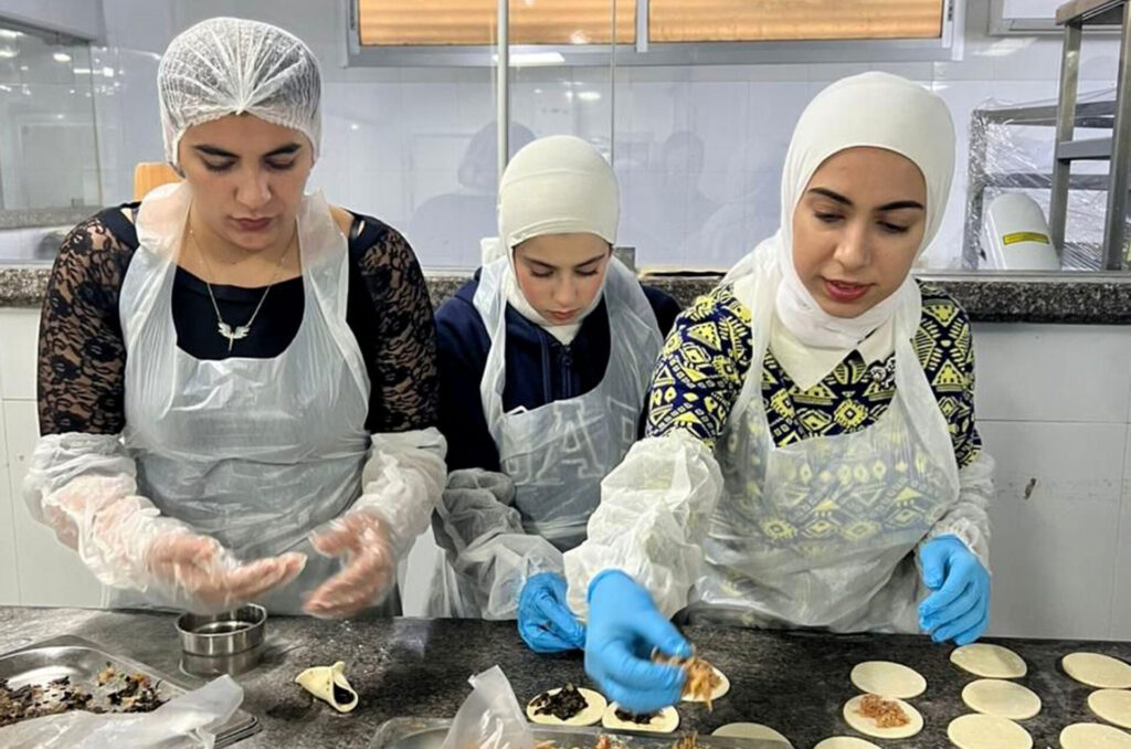 Students in Anera's chef training course with Amaleen.