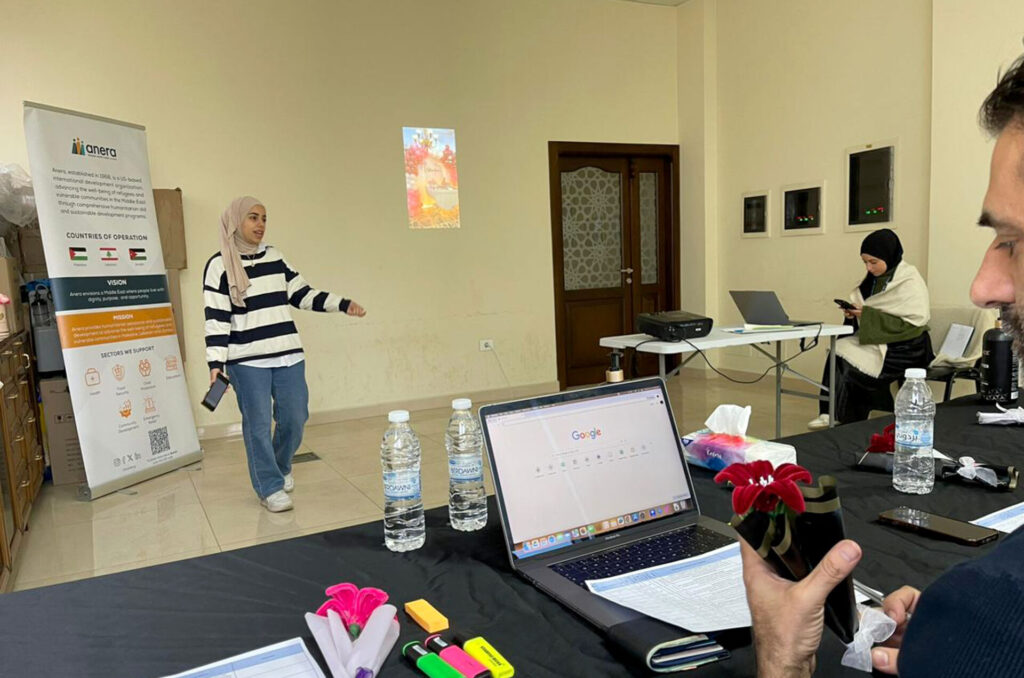 A student in Anera's Business Start-Up Training program gives a pitching presentation.