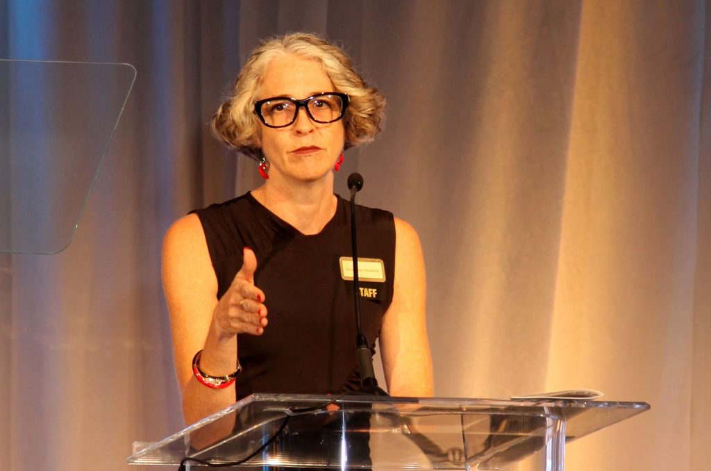 Alicia Philips Mandaville, Anera's acting CEO, delivers remarks to the room.