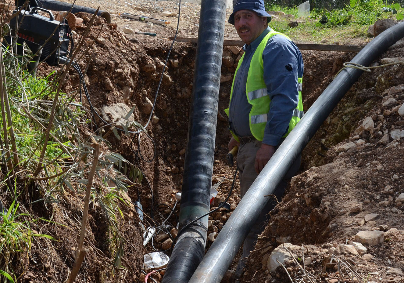 Construction workers have just finished laying 2 kilometers of metal pipelines feeding the main water reservoir.