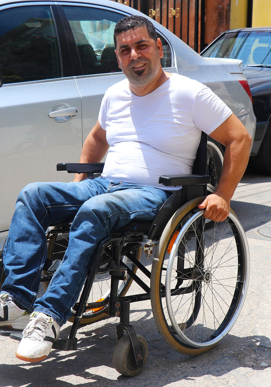 Ali in his new wheelchair thanks to Anera and Wheels to Heal.