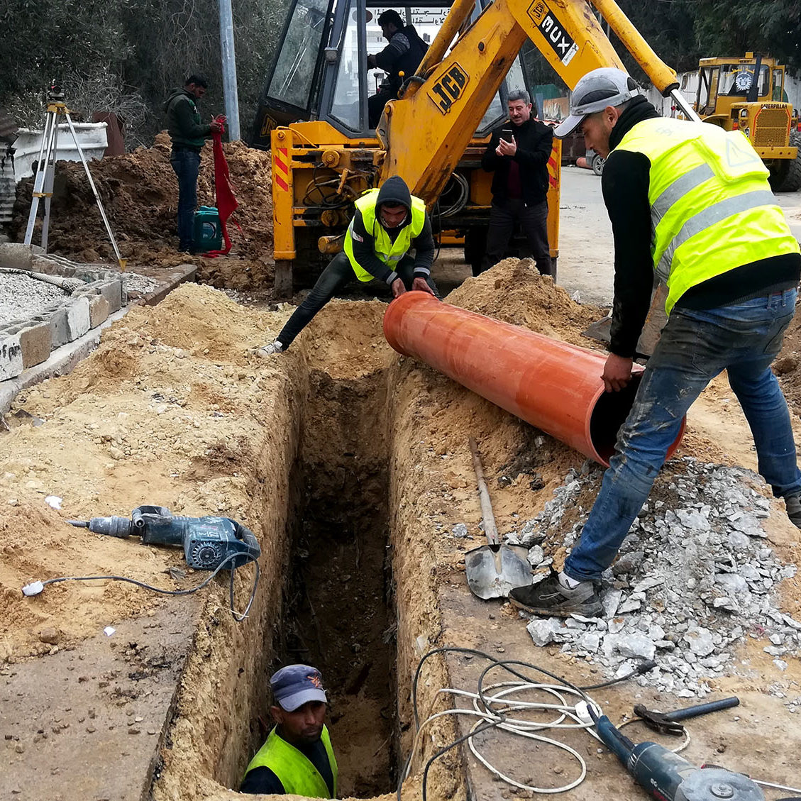 Workers installing storm-water drainage pipes in Beit Hanoun. Workers installing storm-water drainage pipes in Beit Hanoun.